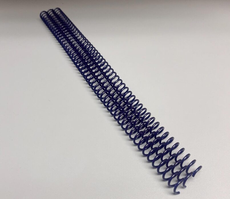 A single 3/8" x 12" #4 Navy Spiral Plastic binding coil is displayed on a plain white surface.