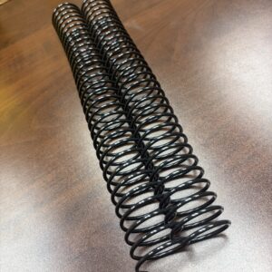Two 1+3/8″ x12″ #2.5 Black Spiral Plastic binding coils.